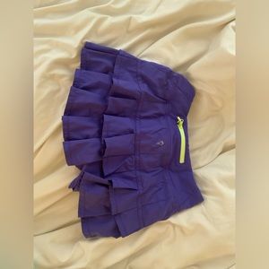 Ivivva tennis skirt, lightly worn, fits me and I’m a small or extra small.
